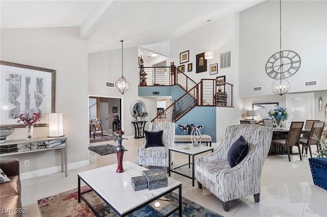 2222 Lucerne Ct, Henderson, NV 89014 - living area with a chandelier, high vaulted ceiling, stairs, and baseboards