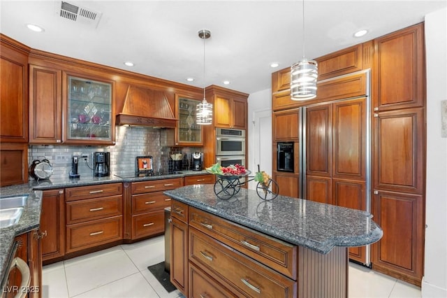 2222 Lucerne Ct, Henderson, NV 89014 - kitchen with custom range hood, stainless steel double oven, light tile patterned floors, tasteful backsplash, and recessed lighting