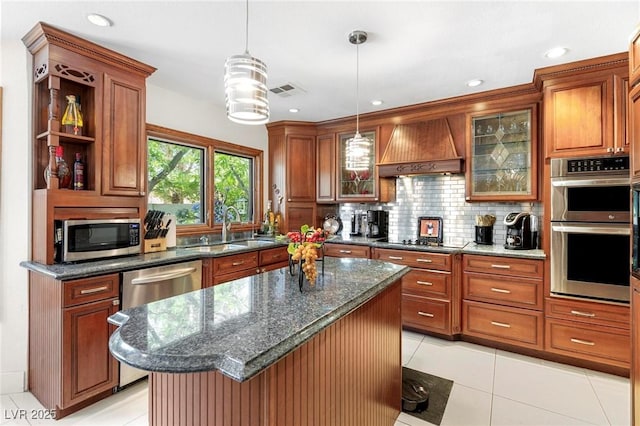 2222 Lucerne Ct, Henderson, NV 89014 - kitchen with appliances with stainless steel finishes, premium range hood, tasteful backsplash, light tile patterned floors, and pendant lighting