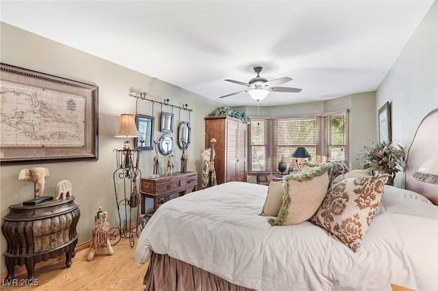 2222 Lucerne Ct, Henderson, NV 89014 - bedroom featuring light wood-style floors, baseboards, and a ceiling fan