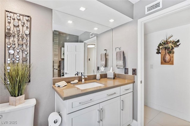 2222 Lucerne Ct, Henderson, NV 89014 - bathroom with toilet, vanity, and tile patterned floors