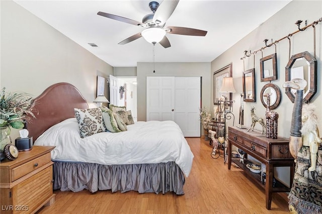 2222 Lucerne Ct, Henderson, NV 89014 - bedroom with light wood-type flooring, a closet, and ceiling fan
