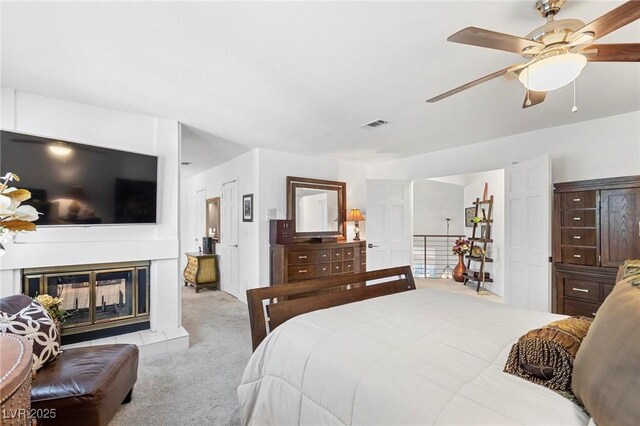 2222 Lucerne Ct, Henderson, NV 89014 - bedroom with carpet flooring, a multi sided fireplace, and ceiling fan