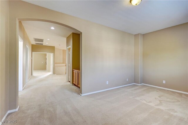 11478 Bargetto Ct, Las Vegas, NV 89141 - spare room with arched walkways, light carpet, baseboards, and recessed lighting