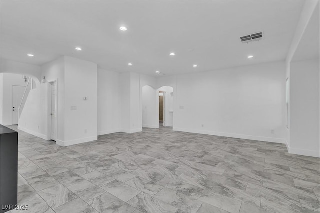 4016 Owlshead Mountain St, Las Vegas, NV 89129 - empty room with arched walkways, recessed lighting, baseboards, and light marble finish floors