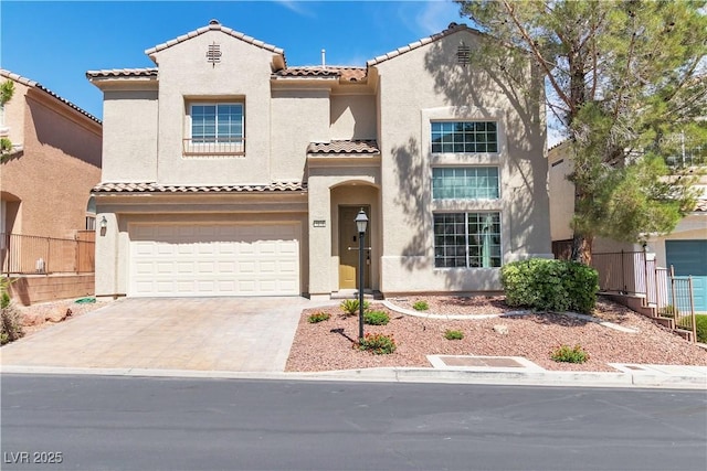 4016 Owlshead Mountain St, Las Vegas, NV 89129 - mediterranean / spanish-style home featuring a tiled roof, stucco siding, a garage, and driveway
