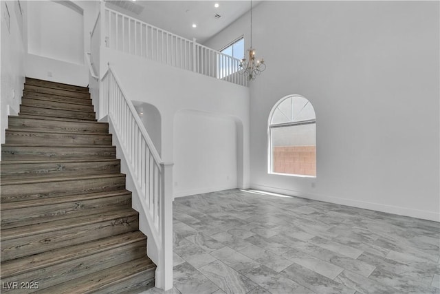 4016 Owlshead Mountain St, Las Vegas, NV 89129 - stairway with marble finish flooring, a towering ceiling, a chandelier, recessed lighting, and baseboards