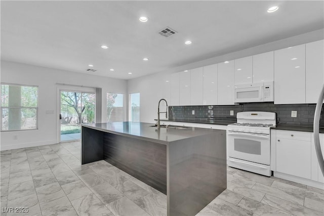 4016 Owlshead Mountain St, Las Vegas, NV 89129 - kitchen with white appliances, modern cabinets, light marble finish floors, a sink, and recessed lighting