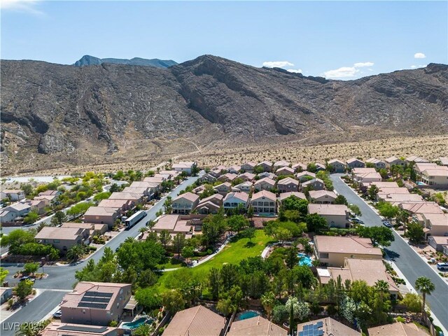 4016 Owlshead Mountain St, Las Vegas, NV 89129 - aerial overview of property's location featuring nearby suburban area and a mountainous background