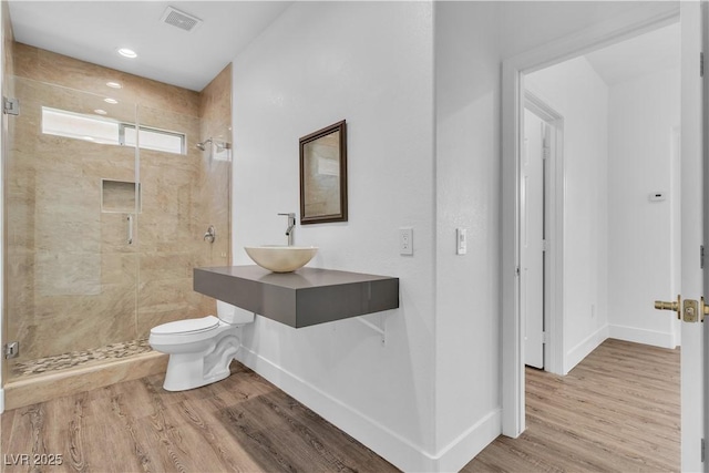4016 Owlshead Mountain St, Las Vegas, NV 89129 - bathroom with a sink, baseboards, toilet, a shower stall, and wood finished floors