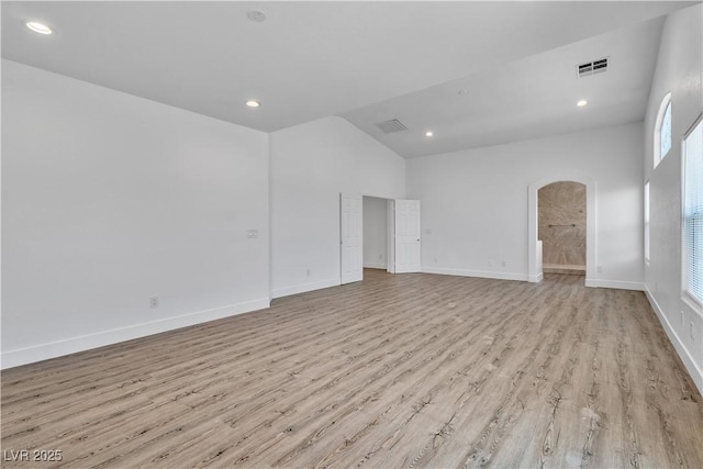 4016 Owlshead Mountain St, Las Vegas, NV 89129 - empty room with arched walkways, light wood finished floors, vaulted ceiling, baseboards, and recessed lighting