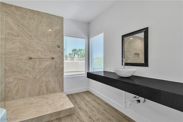 4016 Owlshead Mountain St, Las Vegas, NV 89129 - bathroom with a sink, wood finished floors, baseboards, and a shower