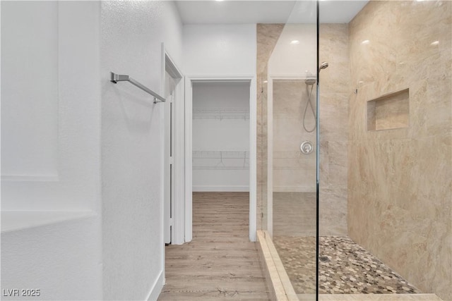 4016 Owlshead Mountain St, Las Vegas, NV 89129 - full bathroom featuring walk in shower, wood finished floors, a spacious closet, and baseboards