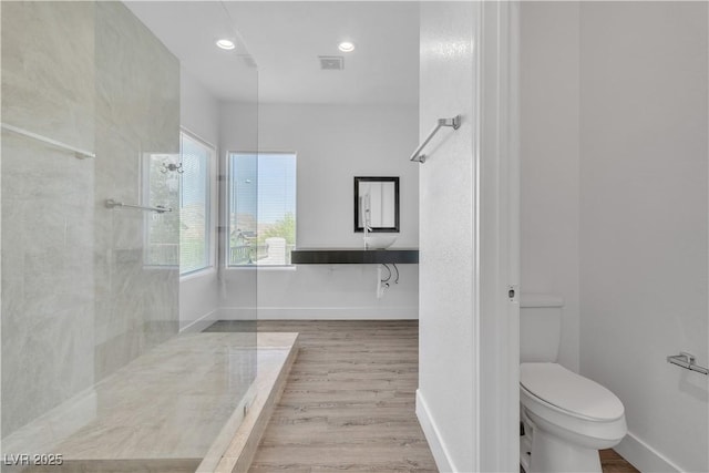 4016 Owlshead Mountain St, Las Vegas, NV 89129 - full bathroom featuring toilet, wood finished floors, baseboards, recessed lighting, and walk in shower