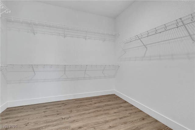 4016 Owlshead Mountain St, Las Vegas, NV 89129 - walk in closet featuring wood finished floors