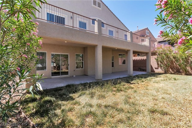 4016 Owlshead Mountain St, Las Vegas, NV 89129 - back of house with stucco siding, a patio area, and a balcony