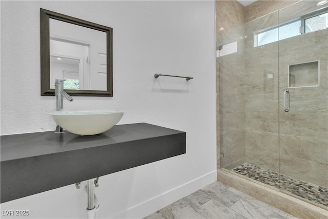 4016 Owlshead Mountain St, Las Vegas, NV 89129 - bathroom featuring baseboards, a stall shower, vanity, and marble look tile flooring