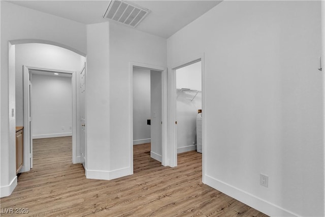 4016 Owlshead Mountain St, Las Vegas, NV 89129 - unfurnished bedroom with arched walkways, light wood-style floors, a closet, baseboards, and a spacious closet