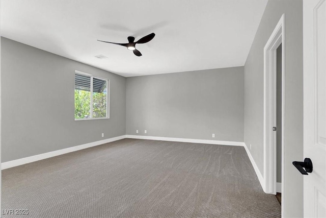 9116 Vista Greens Way Unit 104, Las Vegas, NV 89134 - spare room featuring a ceiling fan, dark colored carpet, and baseboards