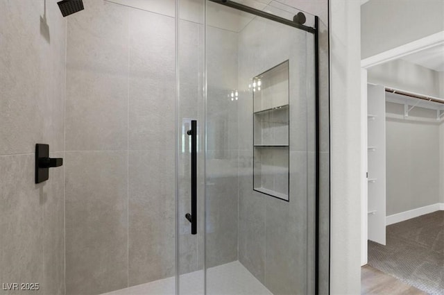 9116 Vista Greens Way Unit 104, Las Vegas, NV 89134 - bathroom featuring a stall shower and a walk in closet
