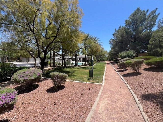 9116 Vista Greens Way Unit 104, Las Vegas, NV 89134 - surrounding community with a lawn