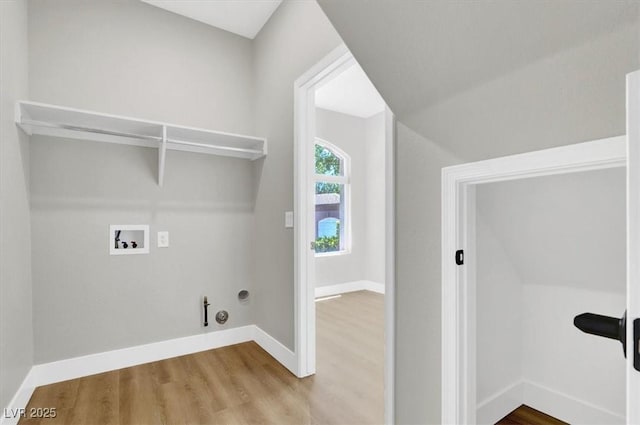 9116 Vista Greens Way Unit 104, Las Vegas, NV 89134 - laundry room featuring washer hookup, gas dryer hookup, wood finished floors, and baseboards