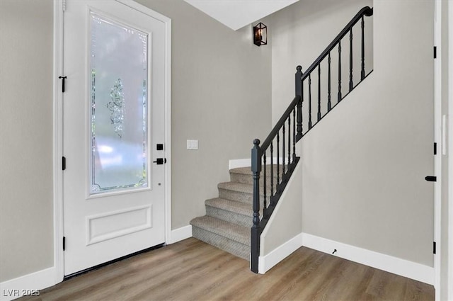 9116 Vista Greens Way Unit 104, Las Vegas, NV 89134 - entrance foyer with baseboards, wood finished floors, and stairs