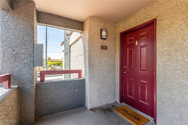 8600 W Charleston Blvd Unit 2187, Las Vegas, NV 89117 - view of exterior entry with stucco siding and covered porch