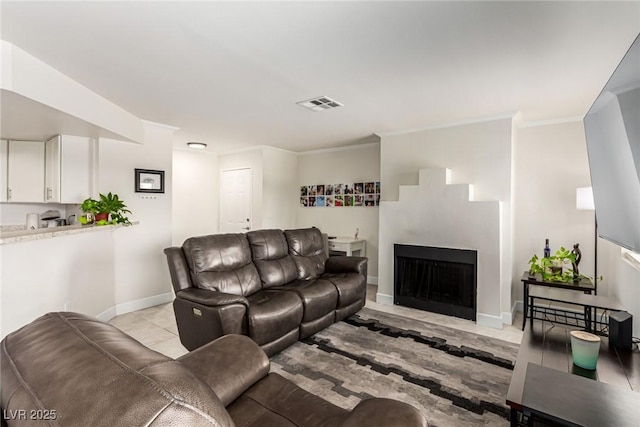 8600 W Charleston Blvd Unit 2187, Las Vegas, NV 89117 - living area featuring baseboards, ornamental molding, and a fireplace with flush hearth