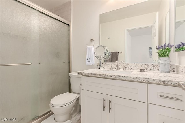 8600 W Charleston Blvd Unit 2187, Las Vegas, NV 89117 - bathroom with vanity, toilet, and a stall shower