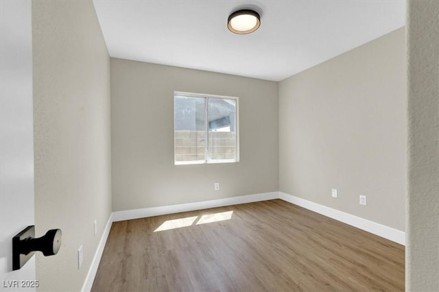 1225 Stonesthrow Cir, North Las Vegas, NV 89031 - unfurnished room with wood finished floors and baseboards