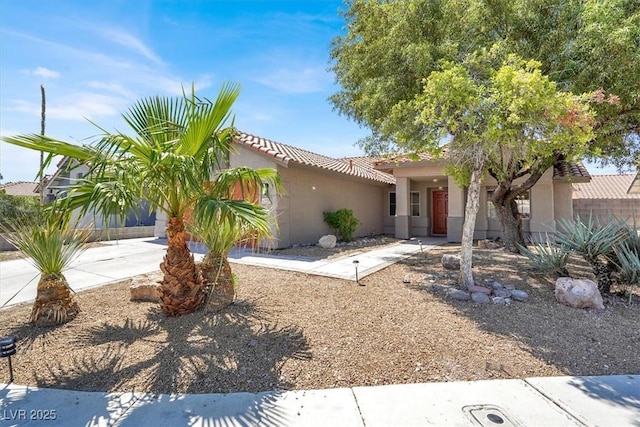 1225 Stonesthrow Cir, North Las Vegas, NV 89031 - view of front of property with stucco siding and a tiled roof