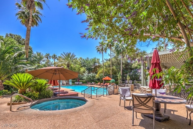 8737 Red Brook Dr Unit 204, Las Vegas, NV 89128 - community pool featuring a community hot tub and a patio
