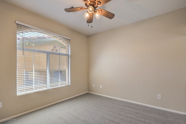 8737 Red Brook Dr Unit 204, Las Vegas, NV 89128 - spare room featuring baseboards, carpet, and ceiling fan