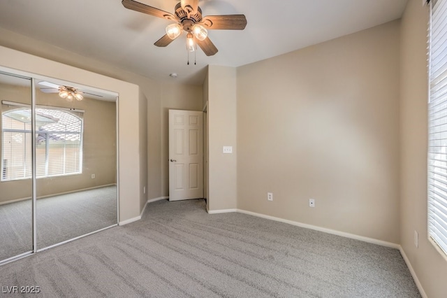 8737 Red Brook Dr Unit 204, Las Vegas, NV 89128 - unfurnished bedroom with carpet flooring, baseboards, ceiling fan, and a closet