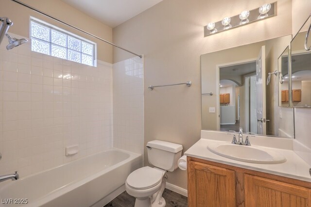 8737 Red Brook Dr Unit 204, Las Vegas, NV 89128 - full bath featuring toilet, shower / bath combination, vanity, wood finished floors, and baseboards