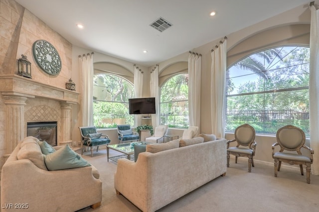 8737 Red Brook Dr Unit 204, Las Vegas, NV 89128 - living room featuring plenty of natural light, carpet floors, recessed lighting, a tile fireplace, and baseboards