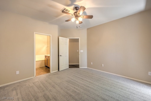 8737 Red Brook Dr Unit 204, Las Vegas, NV 89128 - unfurnished bedroom featuring light carpet, baseboards, ensuite bath, and ceiling fan