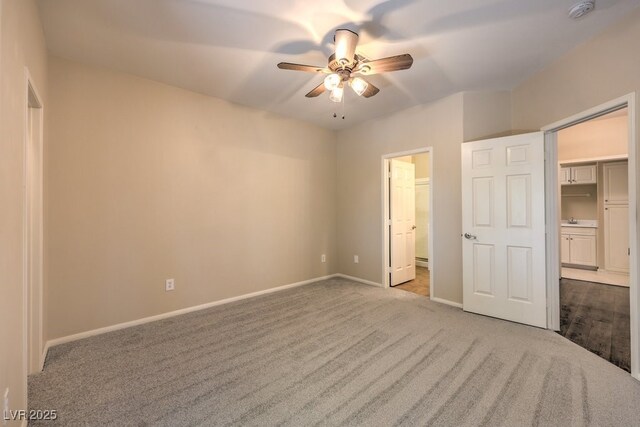 8737 Red Brook Dr Unit 204, Las Vegas, NV 89128 - unfurnished bedroom with carpet, baseboards, ensuite bathroom, ceiling fan, and a sink