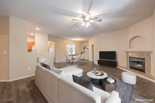 8737 Red Brook Dr Unit 204, Las Vegas, NV 89128 - living area featuring ceiling fan, wood finished floors, a premium fireplace, and baseboards
