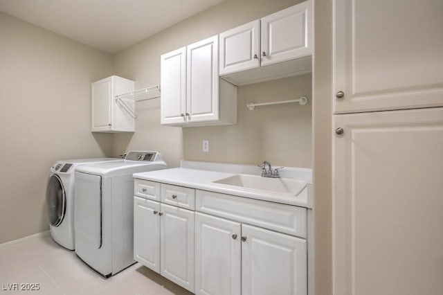 8737 Red Brook Dr Unit 204, Las Vegas, NV 89128 - washroom featuring independent washer and dryer, cabinet space, baseboards, and light tile patterned floors