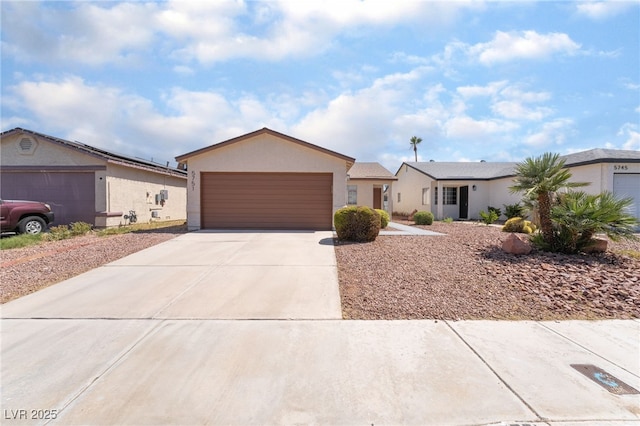 5751 Mabel Rd, Las Vegas, NV 89110 - single story home featuring stucco siding, an attached garage, and driveway