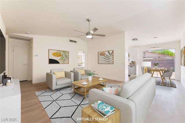 5751 Mabel Rd, Las Vegas, NV 89110 - living room featuring light wood finished floors, a ceiling fan, and lofted ceiling