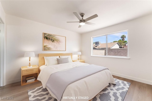 5751 Mabel Rd, Las Vegas, NV 89110 - bedroom featuring baseboards, wood finished floors, and a ceiling fan