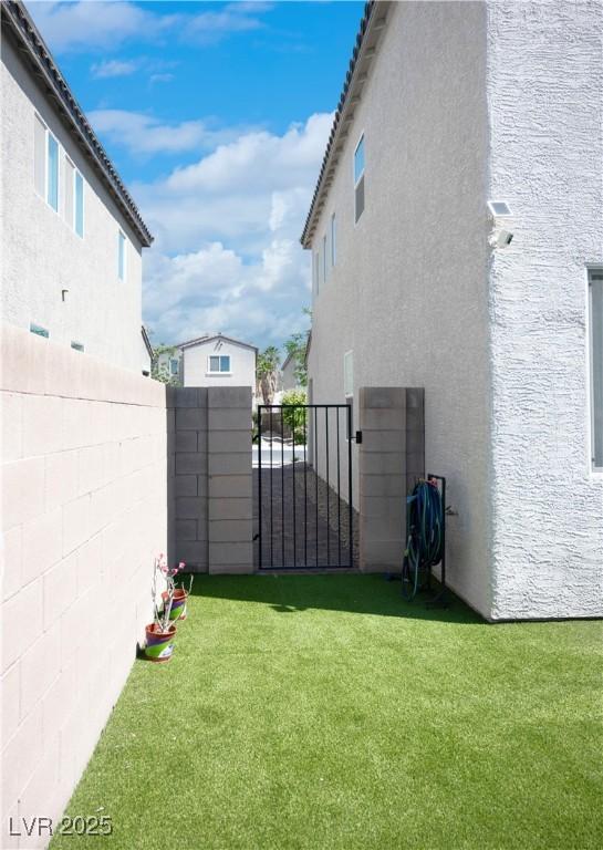 1703 Game Garden Rd, North Las Vegas, NV 89031 - view of yard featuring a gate