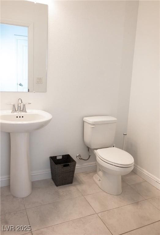 1703 Game Garden Rd, North Las Vegas, NV 89031 - bathroom with toilet, tile patterned floors, and baseboards