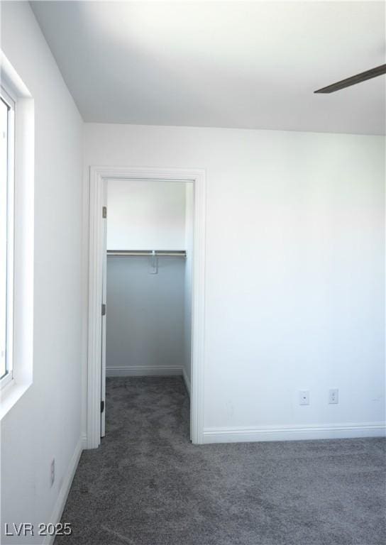 1703 Game Garden Rd, North Las Vegas, NV 89031 - unfurnished bedroom featuring carpet flooring, a spacious closet, baseboards, and a closet