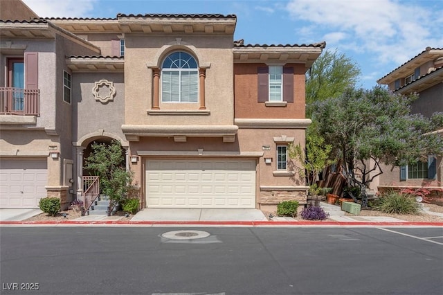 9975 Sand Key St, Las Vegas, NV 89178 - view of front of property with a garage, stucco siding, concrete driveway, and a tiled roof