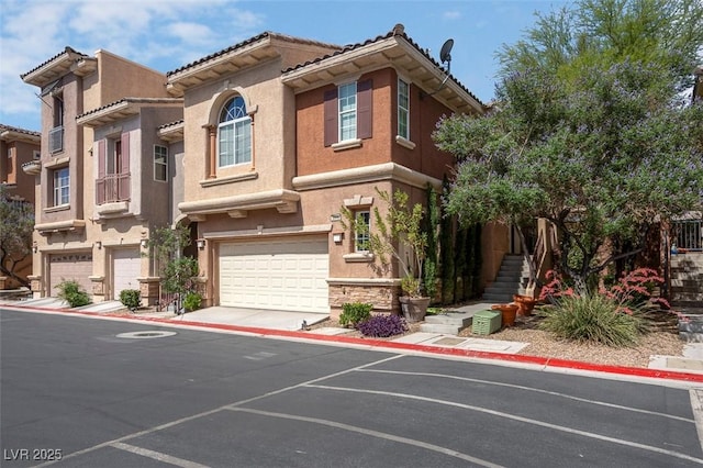 9975 Sand Key St, Las Vegas, NV 89178 - townhome / multi-family property with a garage, stucco siding, and a tiled roof