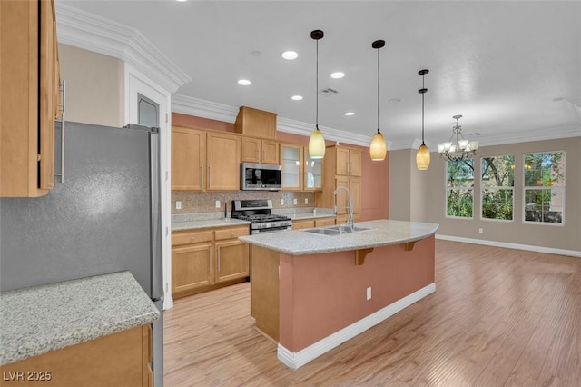 9975 Sand Key St, Las Vegas, NV 89178 - kitchen with appliances with stainless steel finishes, ornamental molding, backsplash, a chandelier, and light wood-style floors